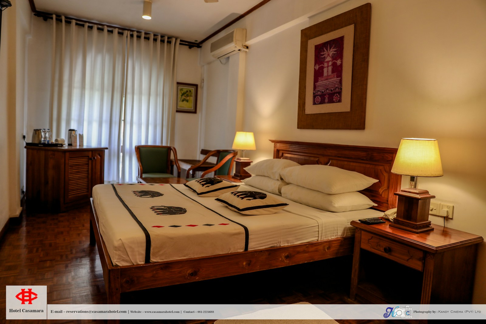 a hotel room with a bed and a desk